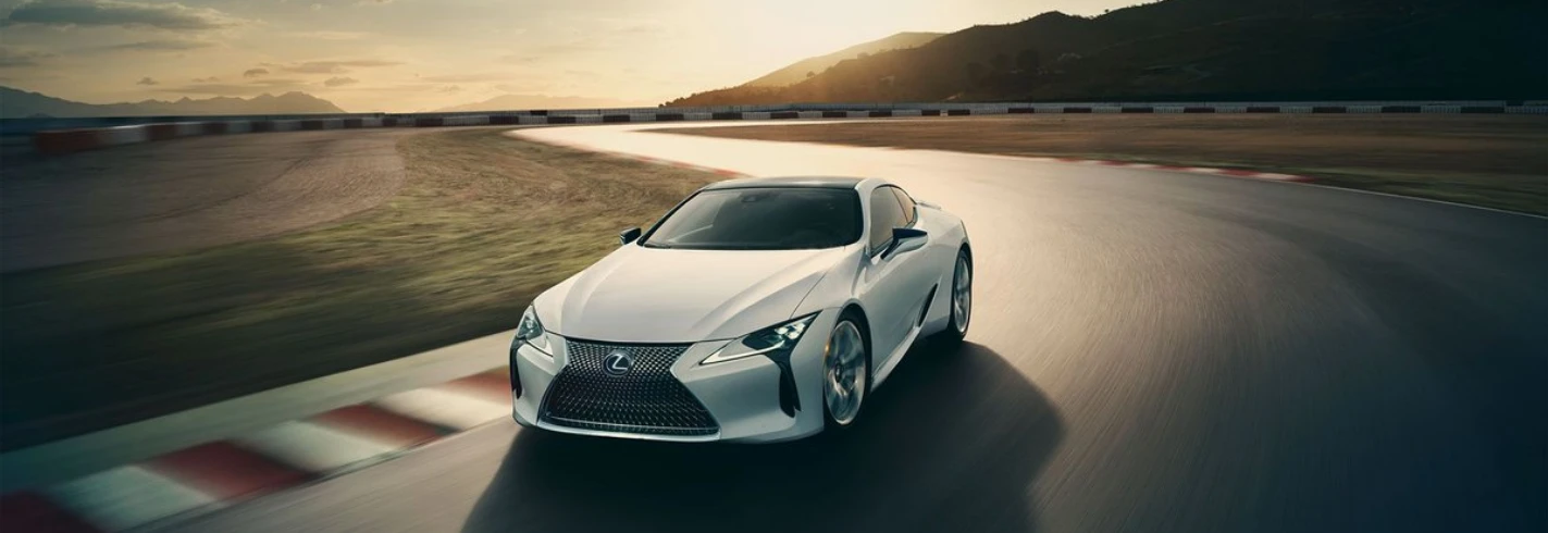 White Lexus LC 500 on a sunlit racetrack