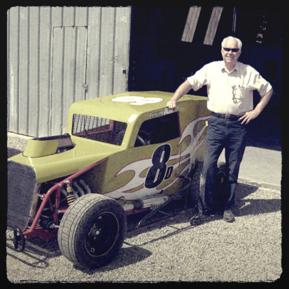 Leroy Kay, here beside his dwarf car, only took up racing in 2007, at the age of 61. Reticent by nature, Kay blossomed at the race track, bonding easily with the younger drivers and reveling in the camaraderie of the garage. “My family is at the track,” he said.