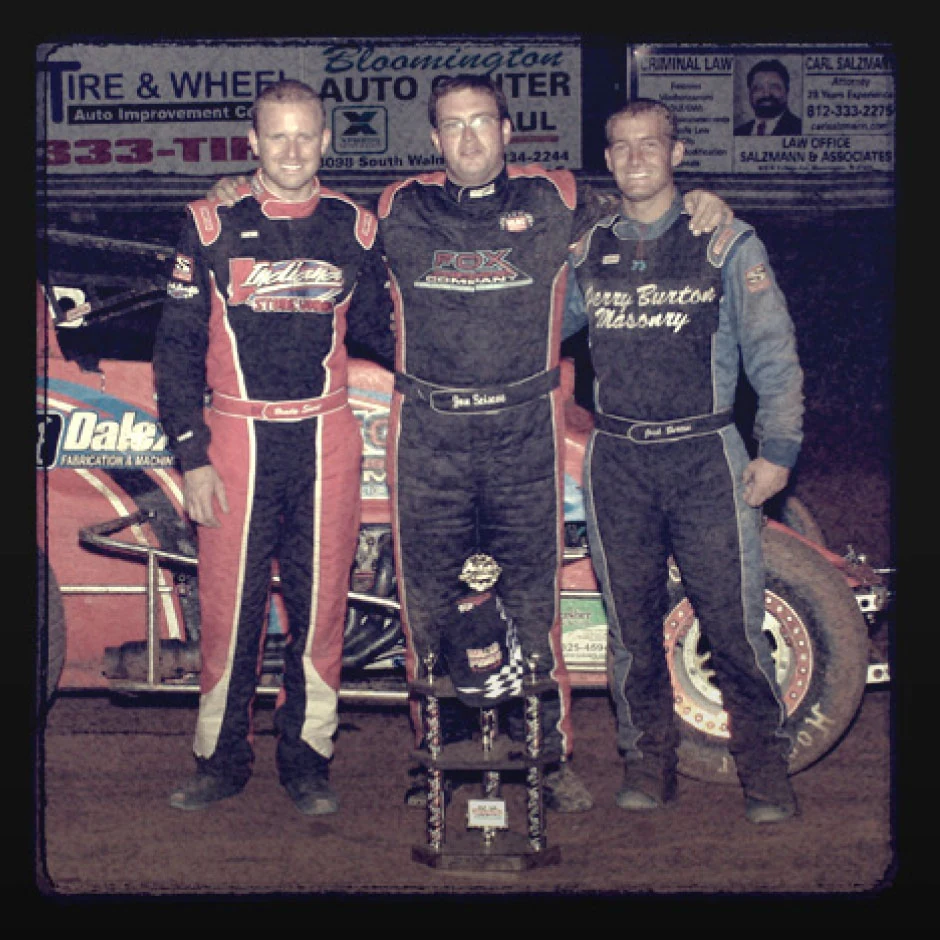 Racers at the hundreds of dirt tracks across the country seldom earn more than a trophy and a few hundred dollars for their efforts, while spending much more to field a competitive car, For most, the sport is a hobby, but Josh Burton (right) had the talent and ambition to dream of more.