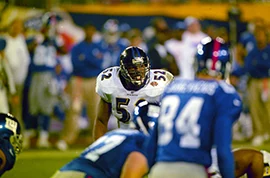 Ravens linebacker Ray Lewis surveys the Giants offense before the snap. Lewis was named the game's MVP after his performance in Super Bowl XXXV. John W. McDonough/SI