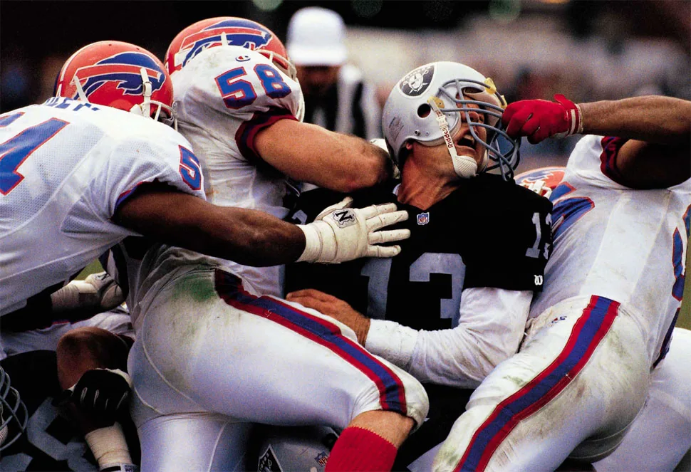 JAY SCHROEDER The Raiders’ QB probably thought a face mask penalty was not a great enough punishment for what the Bills did to him in a 1991 game.