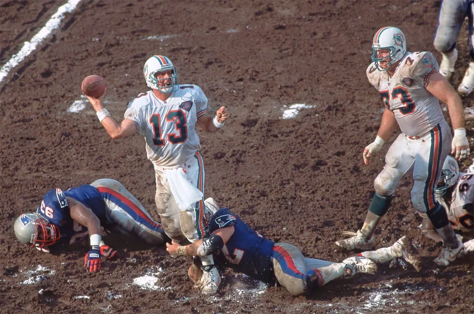 Even with his feet on unsure turf while in the grasp of a Patriots defender, the Dolphins’ Dan Marino was still an armed and dangerous threat.